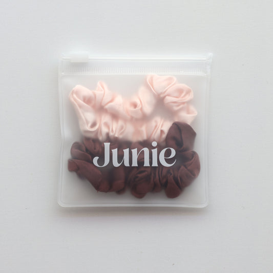 Set of pink and brown scrunchies in a clear packaging zip lock bag with 'Junie' branding
Junie hair scrunchies in pastel colours, neatly packaged for gifting or storage