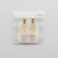 Junie crease-free hair clips in ivory with gold accents, neatly packaged in a reusable zip lock bag with Junie branding for gifting or storage
