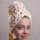 Front profile of Junie fast-drying hair towel for thick hair that takes longer to dry, featuring a secure wrap design that gently dries hair faster without friction or damage. Works for all hair types.