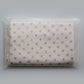 Polka dot Junie quick dry hair towel in zip lock packaging on a white background