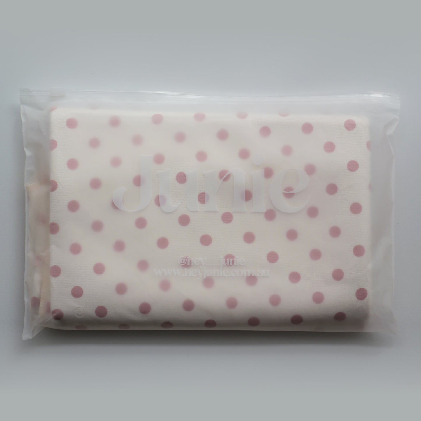 Polka dot Junie quick dry hair towel in zip lock packaging on a white background
