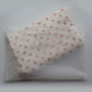 Polka dot Junie quick dry hair towel in peaches and cream colour way in a clear zip lock packaging on a white background