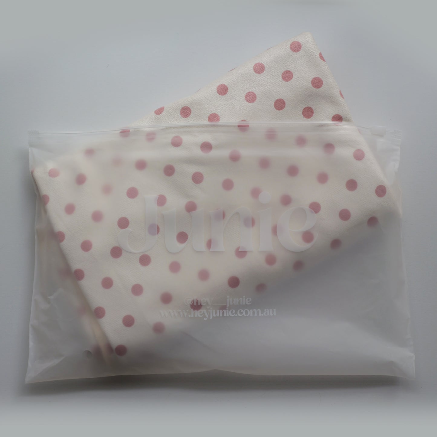 Polka dot Junie quick dry hair towel in peaches and cream colour way in a clear zip lock packaging on a white background