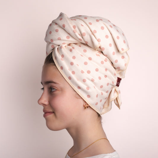 Side profile of the Junie Peaches and Cream fast drying hair towel wrapped snugly around the head