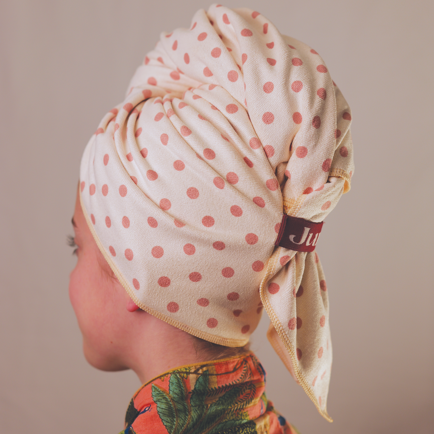 Person wearing a Junie polka dot hair towel with a brand logo on a beige background

Junie fast-drying microfibre hair towel with polka dot design, lightweight and gentle on wet hair, designed to reduce frizz, breakage and drying time. Signature Junie fabric blend.

Junie fast-drying signature blend microfibre hair towel with lightweight, ultra-absorbent fabric that shortens drying time and protects delicate wet hair.