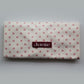 Polka dot Junie quick dry hair towel with peaches and cream print with 'Junie' label on a white background