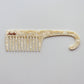 Junie wide-tooth comb in ivory, designed to gently detangle wet or dry hair. Decorative comb with 'Junie' branding on a white background. 